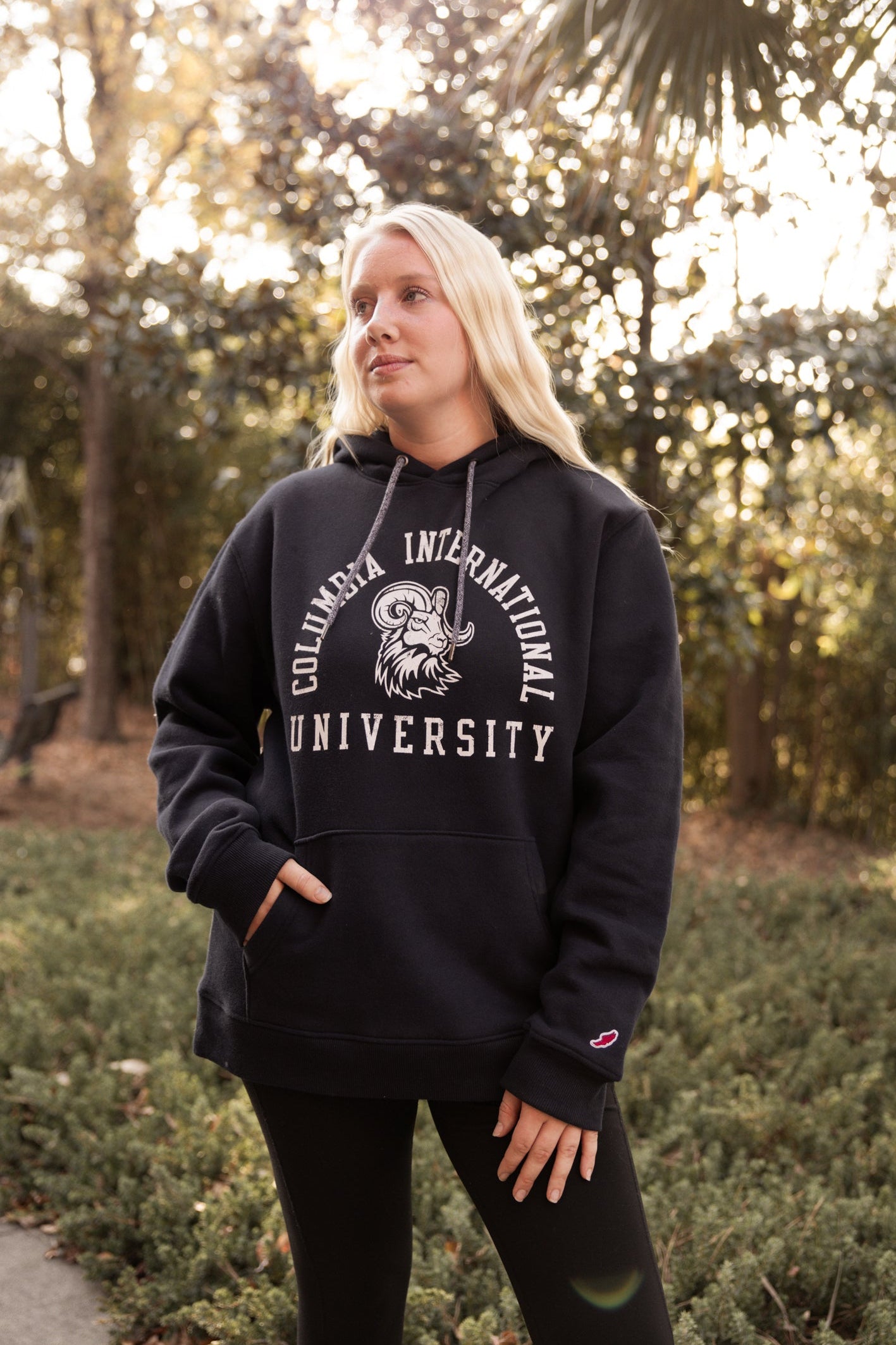 Woman wearing a hoodie with &